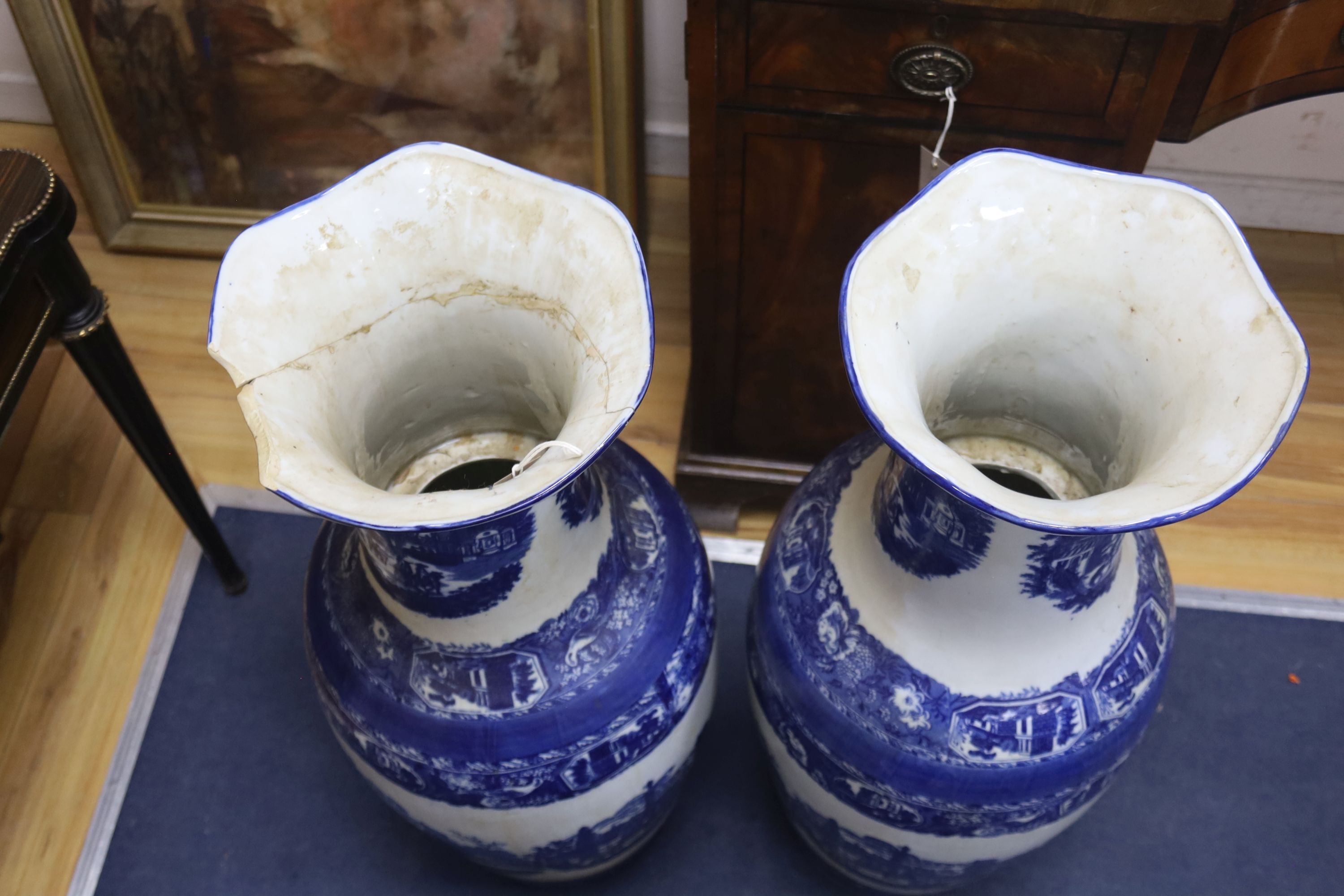 A pair of large blue and white vases 92cm